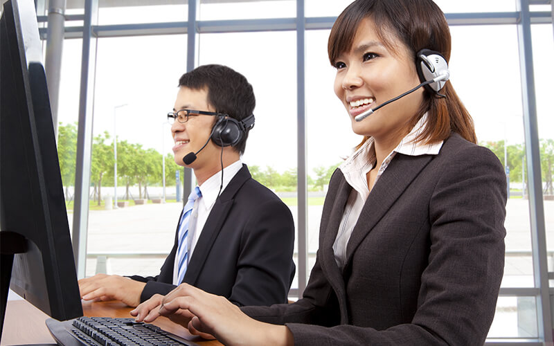 Two customer service agents on the phones